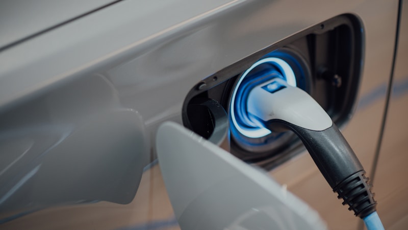 Electric vehicle charging at a station